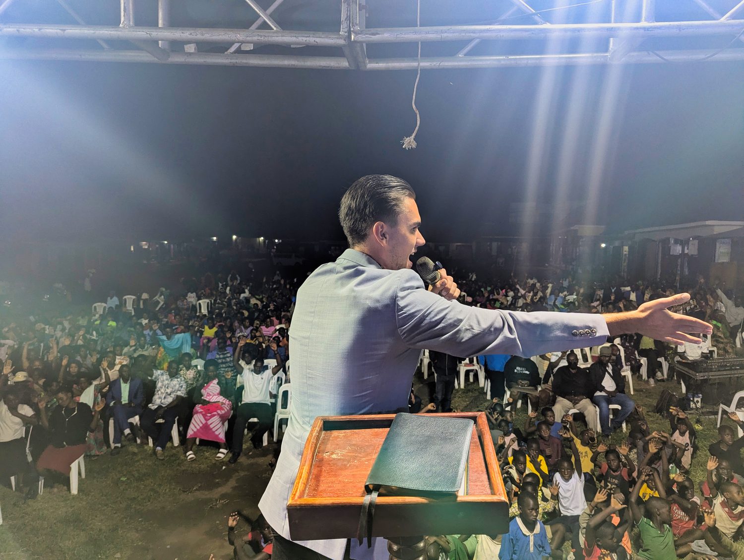 Preaching to the evening crowd from the open-air platform.